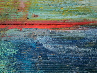 Thick layers of paint on a wooden board