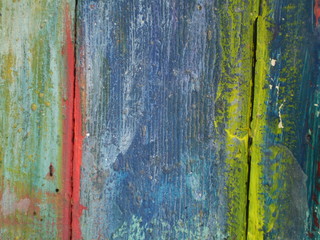 Thick layers of paint on a wooden board