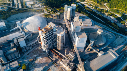 Aerial view of cement manufacturing plant. Concept of buildings at the factory, steel pipes, giants.