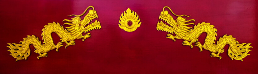 Chinese dragon. A image of golden dragon on a red wooden in chinese temple.
