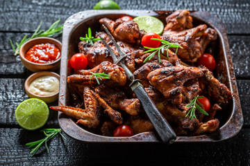 Crispy grilled chicken leg with rosemary and spices