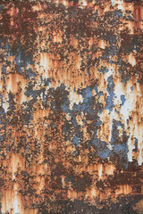 background image of rusted iron, the texture has various shades of red and orange and some blue parts
