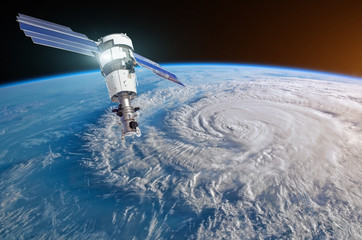 Research, probing, monitoring hurricane Florence raging on the coast. Satellite above the Earth makes measurements of the weather parameters. Elements of this image furnished by NASA. © aapsky