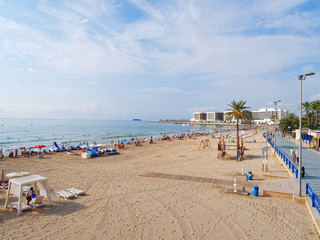 Beautiful promenade along the sandy beach and the sea in Alicante. Spain.