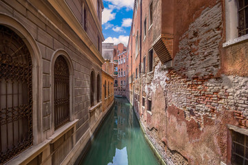 Fototapeta na wymiar View of narrow canal in Venice. Architecture and landmarks of Venice. Italy.