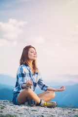 Fototapeta na wymiar Young woman doing yoga in nature