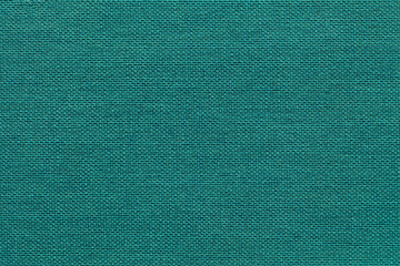 Light cyan background from a textile material with wicker pattern, closeup.