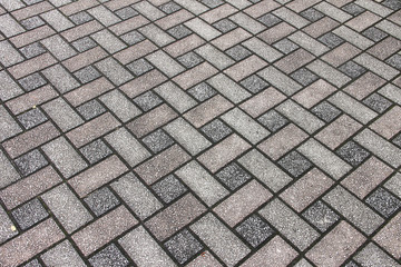 Texture: light street paving slabs of rectangular shape, gray and red.