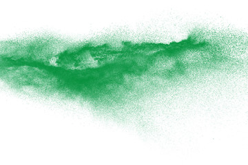 Green dust particles explosion on white background. Powder dust splash.