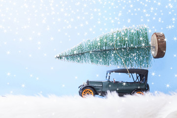 green car with a Christmas tree on the blue background