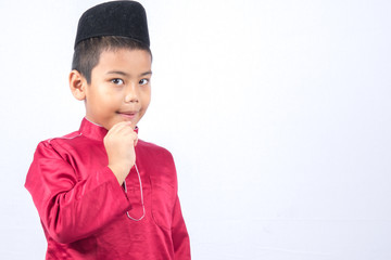Potrait of young asian muslim boy/girl isolated on white background.
