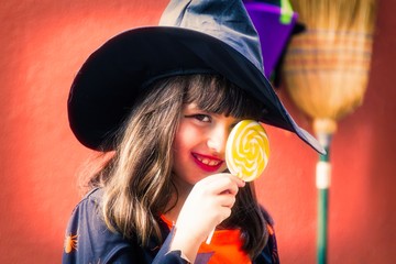 portrait of witch with candies, halloween concept