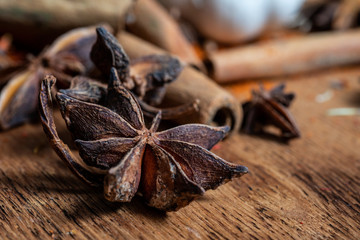 close up of star anise on wooden plank, slective focus