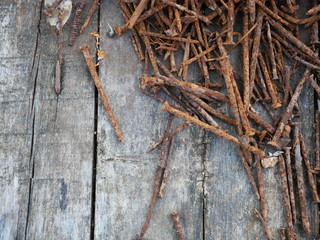 rusty nails and old wood background