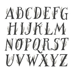 Autumn vector alphabet. Uppercase serif letters decorated with tree branches.