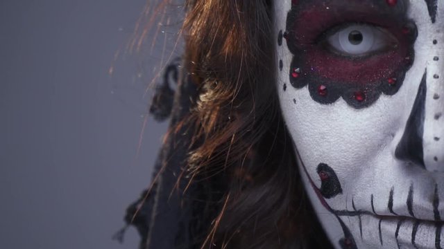 Dead girl, makeup Santa Muerte for Halloween. Close up