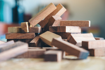 Closeup image of wooden blocks of Jenga or Tumble tower game