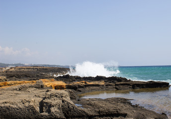 Beautiful seascape with waves crashing against rocks