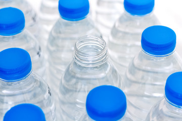 Blue plastic water bottles. Water help to quench their thirst and heat.