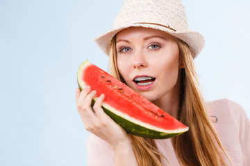 Happy woman holding watermelon
