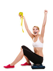 Obraz na płótnie Canvas Woman raising her arms. Successful dieting slimming