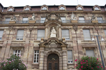 Fototapeta na wymiar Monument on classic retro building at Speyer town in Rhineland Palatinate, Germany