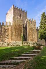 Fototapeta na wymiar Castelo de Guimaraes Castle. Most famous castle in Portugal. Birth place of the first Portuguese King and the Portuguese nation. Guimaraes, Portugal.