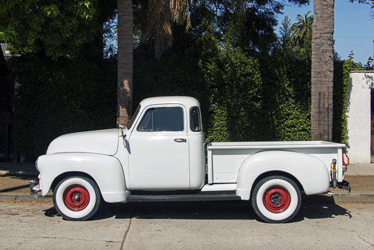 Side view of a vintage classic pick up truck in the street in Los Angeles