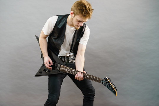 Man playing on electric guitar
