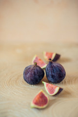 Fresh ripe figs on a light background.