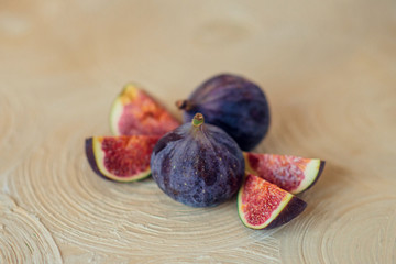 Fresh ripe figs on a light background.
