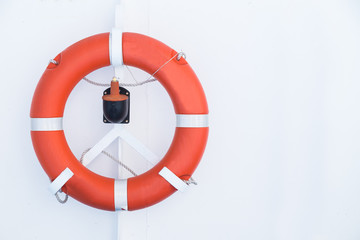Emergency life buoy on board cruise ship against white background