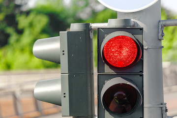 Red traffic light in the city street