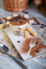 Close up view of beautiful elegant sweet dessert served on the plate. Beautiful decoration, restaurant dish, ready to eat. Tea time, cozy atmosphere.