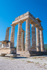 Obraz premium Temple of Zeus at archaeological site of Nemea in Greece. It was built around 330 BC to serve the needs of the Nemian festival and games. It has three architectural styles, doric, ionic and corinthian
