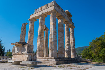 Fototapeta premium Temple of Zeus at archaeological site of Nemea in Greece. It was built around 330 BC to serve the needs of the Nemian festival and games. It has three architectural styles, doric, ionic and corinthian