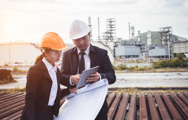 Team engineers and technician working at a petrochemical oil refinery