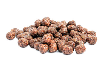 Chocolate balls corn flakes isolated with copy space background. Cereals texture. Side view. Corn Chocolate Flakes Isolated On White Background.