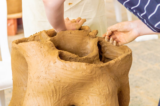 Young students working on their sculpture in an atelier