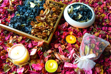Potpourri or dried petals flowers colorful and scented candles

