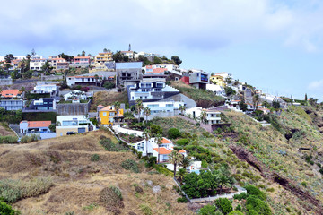 Fototapeta na wymiar Houses on the steep coast in Garajau on the Madeira island, Portugal