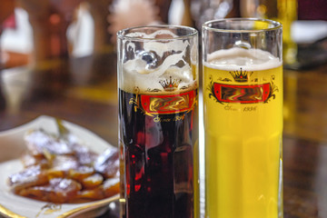 Beer is dark and unfiltered