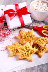 Fototapeta na wymiar Crunchy pistachio christmas star biscuits