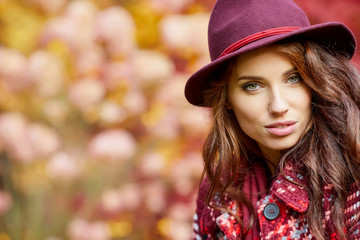 Autumn woman in autumn park , scarf and leather gloves