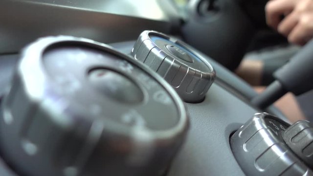 slow motion of car buttons shaking while driving on the road