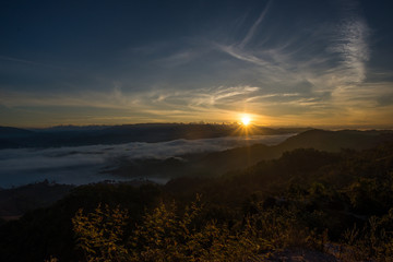 Sunrise over the misty mountains