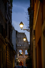 Fototapeta premium Little steret in Roma with Colosseum in background