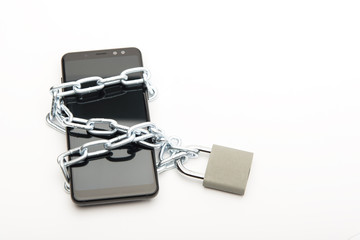 Locked mobile phone with a chain and lock on a white background.