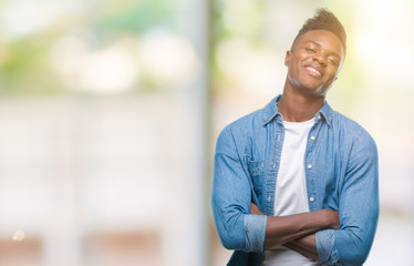 Fototapeta premium Young african american man over isolated background happy face smiling with crossed arms looking at the camera. Positive person.