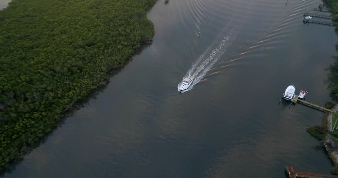 Aerial Pan Around of a Boat Sailing on St Lucie River  
